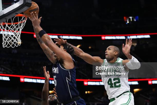Al Horford of the Boston Celtics fouls Paolo Banchero of the Orlando Magic during the fourth quarter of an NBA In-Season Tournament game at Amway...