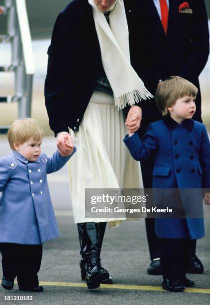 Diana, Princess of Wales, arrives with her sons Prince Harry and Prince William at Aberdeen Airport on March 14, 1986 in Aberdeen, Scotland.