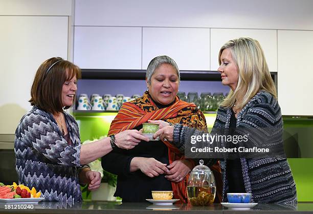 Olivia Newton-John speaks to carer Shirley Archer and patient Ana Noronha prior to the formal opening of the Olivia Newton John Cancer & Wellness...