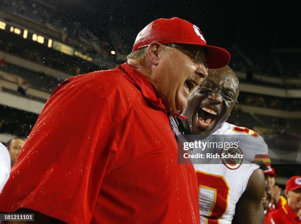 Head coach Andy Reid of the Kansas City Chiefs reacts to getting a Gatorade shower with linebacker Justin Houston after defeating the Philadelphia...