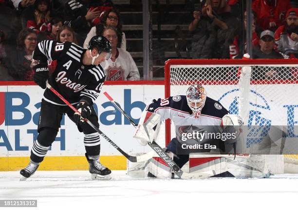 Elvis Merzlikins of the Columbus Blue Jackets stops a shot by Ondrej Palat of the New Jersey Devils during the third period at Prudential Center on...