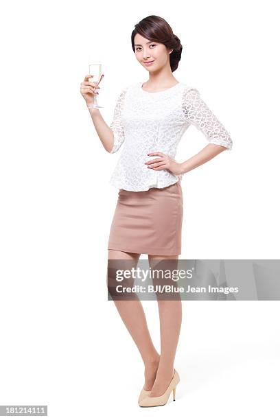 happy young woman with champagne - woman holding champagne stock-fotos und bilder