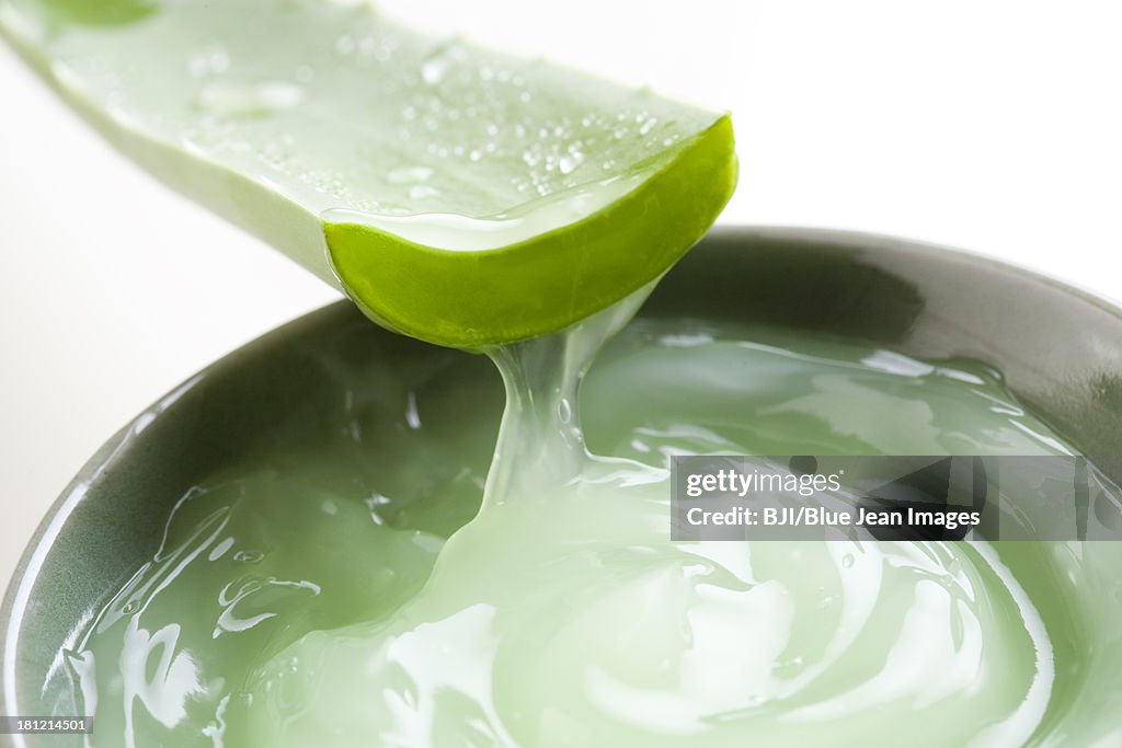 Aloe vera gel and fresh aloe leaf