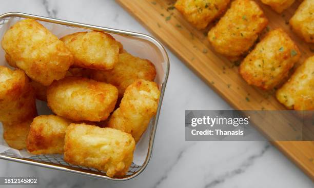 close up of baked tater tots - fritter stock pictures, royalty-free photos & images