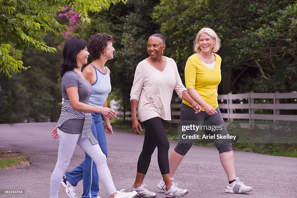Older women walking together outdoors