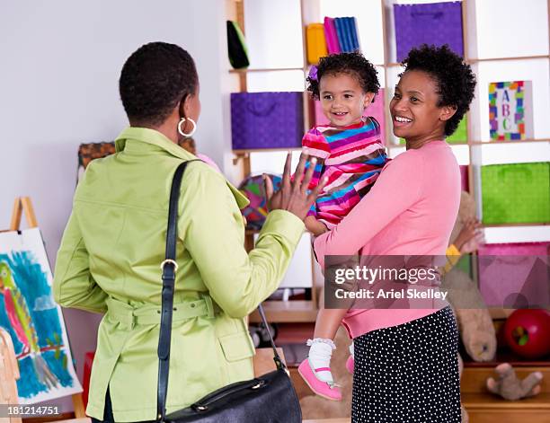 mother and child waving to teacher - farewell in 2012 stock pictures, royalty-free photos & images