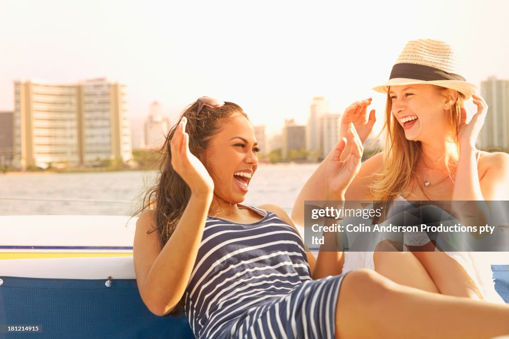 Women laughing together on boat