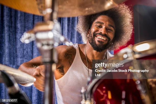 mixed race drummer performing - baterista imagens e fotografias de stock
