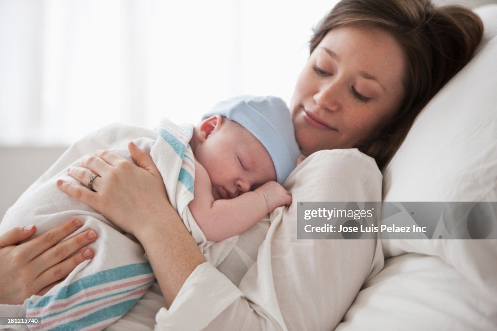 Caucasian mother holding baby