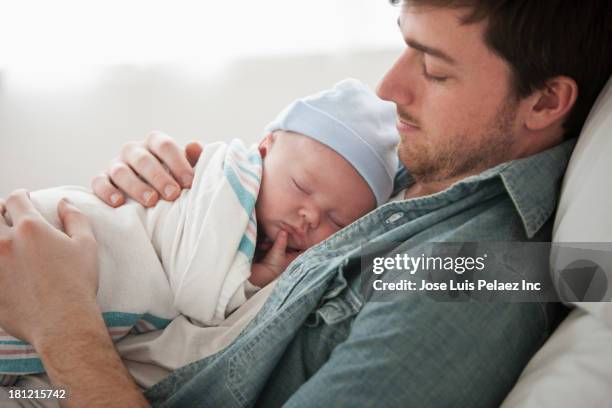 caucasian father holding baby - dad baby stock pictures, royalty-free photos & images