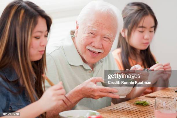 japanese family eating together - teenagers eating with mum stock pictures, royalty-free photos & images