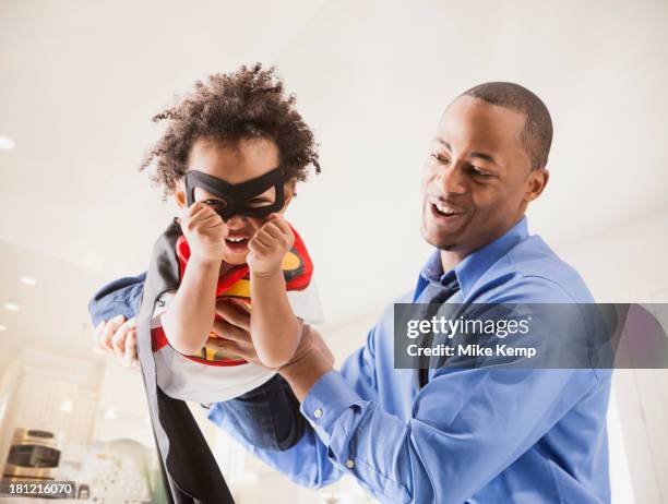 father and son playing superhero - superhero dad stock pictures, royalty-free photos & images