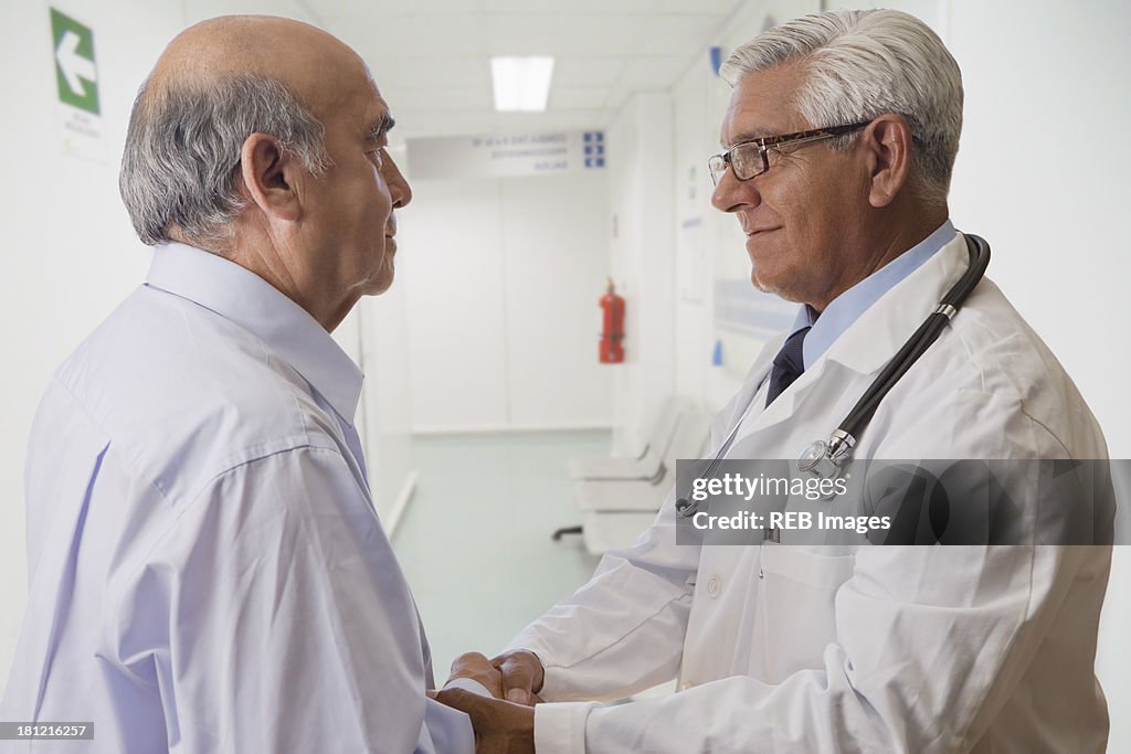 Hispanic doctor talking with patient