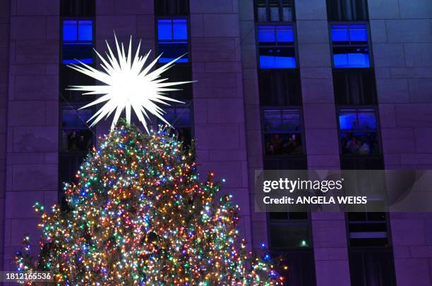 The Swarovski star is seen atop the Christmas Tree during the Rockefeller Center's annual lighting ceremony in New York, November 29, 2023.