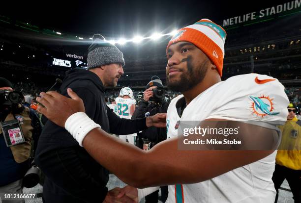 Aaron Rodgers of the New York Jets congratulates Tua Tagovailoa of the Miami Dolphins after the game at MetLife Stadium on November 24, 2023 in East...