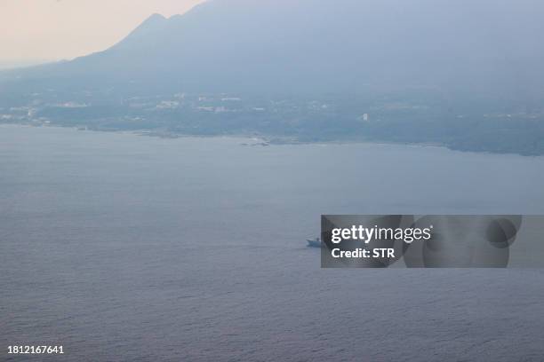 Japan Maritime Self-Defence Force vessel operates at sea off the island of Yakushima on November 30 where a US Osprey aircraft crashed a day before....