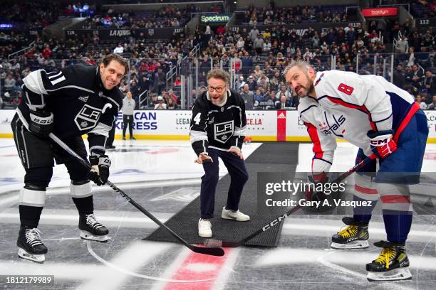 Anze Kopitar of the Los Angeles Kings, Seth Rogen and Alex Ovechkin of the Washington Capitals pose for a photo during the ceremonial puck drop prior...