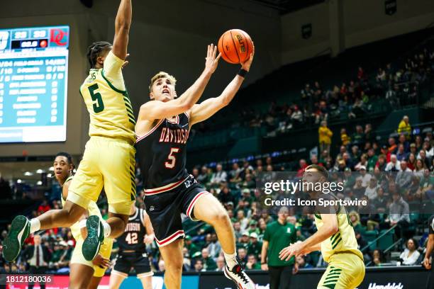 Isaiah Folkes of the Charlotte 49ers defends Grant Huffman of the Davidson Wildcats during the Battle for the Hornets' Nest at Dale F. Halton Arena...