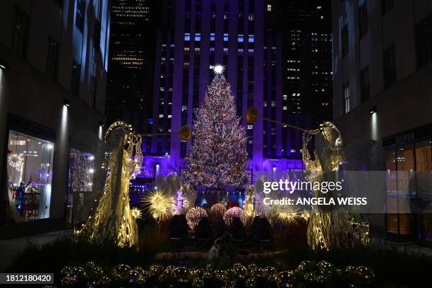 The Swarovski star is seen atop the Christmas Tree during the Rockefeller Center's annual lighting ceremony in New York, on November 29, 2023.