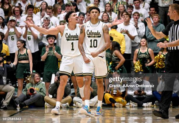 Nique Clifford of the Colorado State Rams flexes after converting a key dunk and making a clutch defensive stop on Cody Williams of the Colorado...
