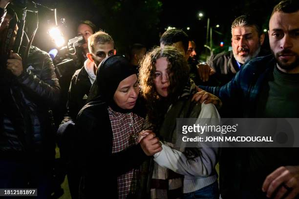 Newly released activist Ahed Tamimi is greeted by relatives during a welcome ceremony following the release of Palestinian prisoners from Israeli...