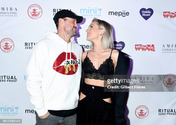 Brian Austin Green and Sharna Burgess at The 10th Annual Winter Wonderland Toys for Tots Charity Event at Yamashiro on November 29, 2023 in Los...