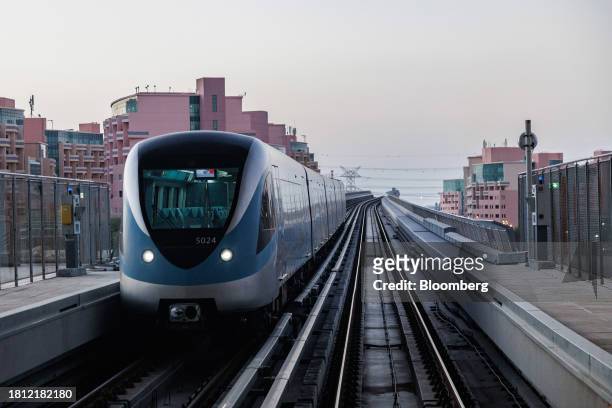 Metro train pulls into a platform in Dubai, United Arab Emirates, on Wednesday, Nov. 29, 2023. More than 70,000 politicians, diplomats, campaigners,...