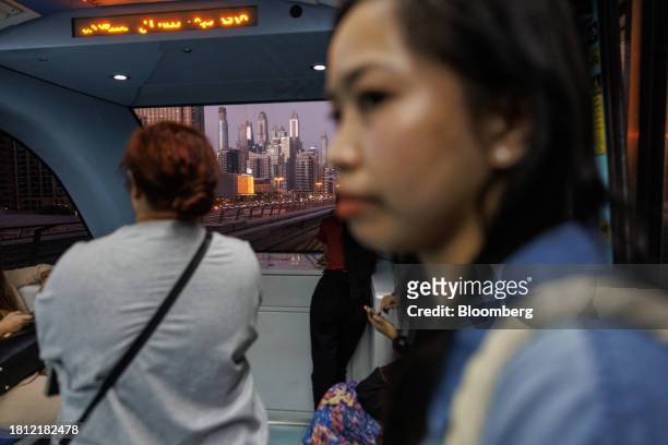 Passengers onboard a metro train in Dubai, United Arab Emirates, on Wednesday, Nov. 29, 2023. More than 70,000 politicians, diplomats, campaigners,...