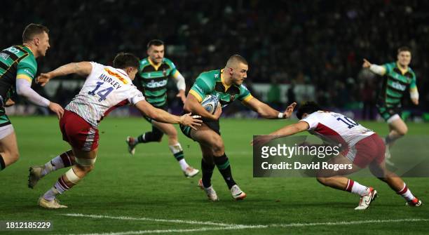 Ollie Sleightholme of Northampton Saints goes past Cadan Murley and Marcus Smith to score their first try during the Gallagher Premiership Rugby...