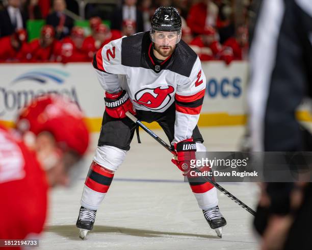 Brendan Smith of the New Jersey Devils gets set for the face-off against the Detroit Red Wings during the second period at Little Caesars Arena on...