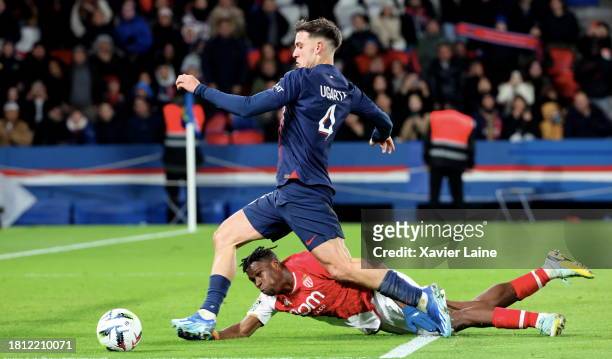 Manuel Ugarte of Paris Saint-Germain in action with Wilfried Singo of Monaco during the Ligue 1 Uber Eats match between Paris Saint-Germain and AS...