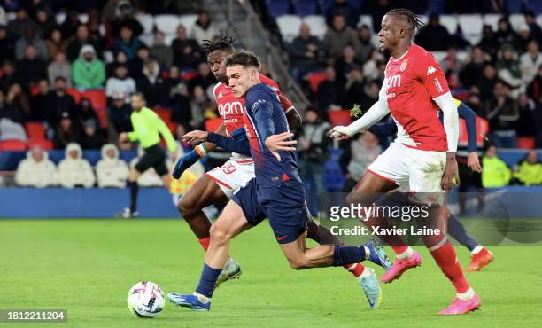 Manuel Ugarte of Paris Saint-Germain in action with Wilfried Singo and Soungoutou Magasa of Monaco during the Ligue 1 Uber Eats match between Paris...