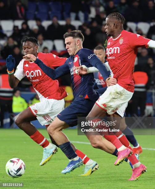 Manuel Ugarte of Paris Saint-Germain in action with Wilfried Singo and Soungoutou Magasa of Monaco during the Ligue 1 Uber Eats match between Paris...