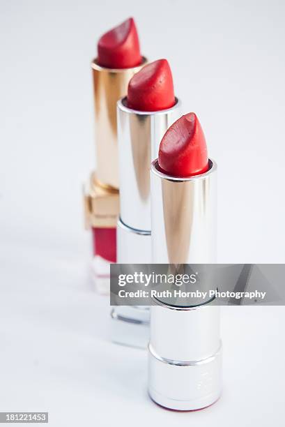 3 red lipsticks - red lipstick stock pictures, royalty-free photos & images