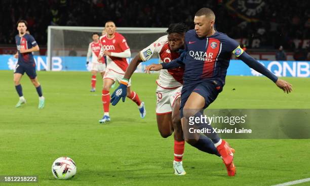 Kylian Mabppe of Paris Saint-Germain in action with Wilfried Singo of Monaco during the Ligue 1 Uber Eats match between Paris Saint-Germain and AS...