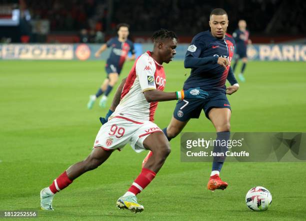 Wilfried Singo of Monaco, Kylian Mbappe of PSG in action during the Ligue 1 Uber Eats match between Paris Saint-Germain and AS Monaco at Parc des...