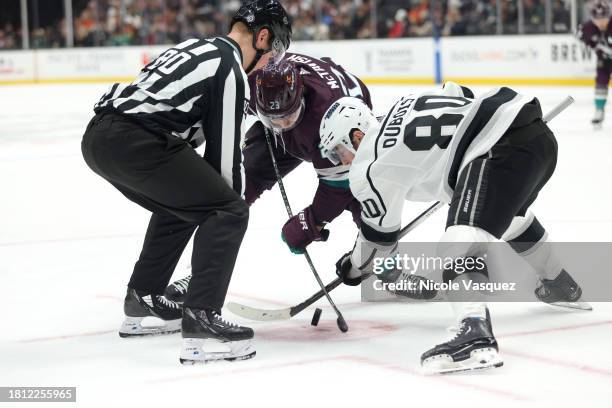 Mason McTavish of the Anaheim Ducks battles Pierre-Luc Dubois of the Los Angeles Kings at the face-off circle in the second period during the game at...