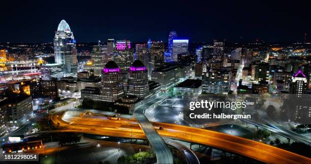 aerial view of the central business district on a clear, fall night in cincinnati, ohio - cincinnati business stock pictures, royalty-free photos & images