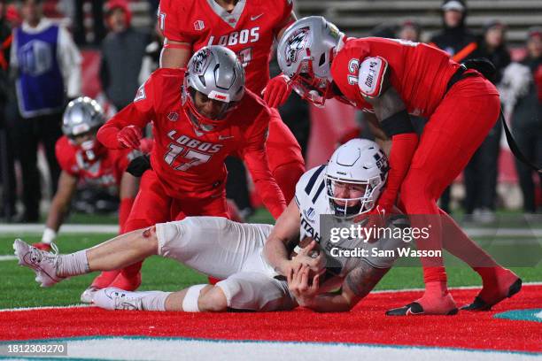 Quarterback Levi Williams of the Utah State Aggies scores the game-winning touchdown against the New Mexico Lobos during the second overtime of their...