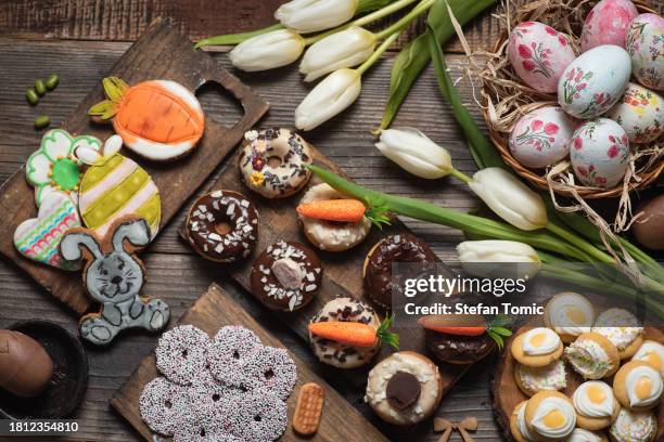 festive table with colorful easter decoration - easter religious stock pictures, royalty-free photos & images