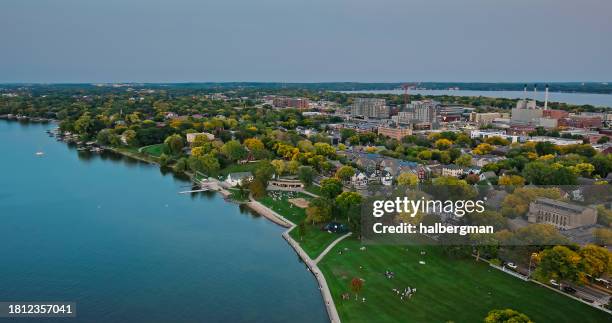 aerial shot of old market place in madison, wisconsin with lake mendota in foreground and lake monona in background - lake mendota stock pictures, royalty-free photos & images