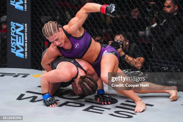 Kayla Harrison punches Aspen Ladd during the 2023 PFL Championships at The Anthem on November 24, 2023 in Washington, DC.