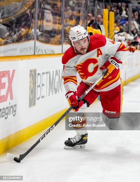 Rasmus Andersson of the Calgary Flames skates against the Nashville Predators during an NHL game at Bridgestone Arena on November 22, 2023 in...