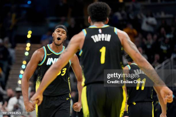 Myles Turner of the Indiana Pacers celebrates his dunk with Obi Toppin during the second half of an NBA In-Season Tournament game against the Detroit...