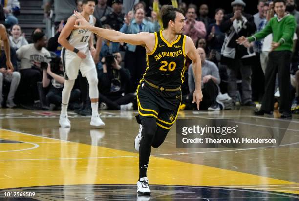 Dario Saric of the Golden State Warriors reacts after making a three-point shot against the San Antonio Spurs during the second quarter of the NBA...