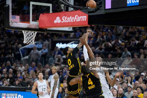 Victor Wembanyama of the San Antonio Spurs is blocked by Gary Payton II of the Golden State Warriors during the second quarter of the NBA In-Season...