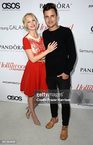 Actors Joe King and Candice Accola arrive at The Hollywood Reporter's Emmy Party at Soho House on September 19, 2013 in West Hollywood, California.