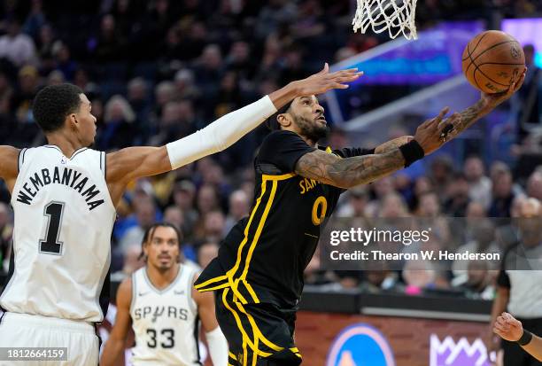 Gary Payton II of the Golden State Warriors shoots over Victor Wembanyama of the San Antonio Spurs during the third quarter of an NBA In-Season...