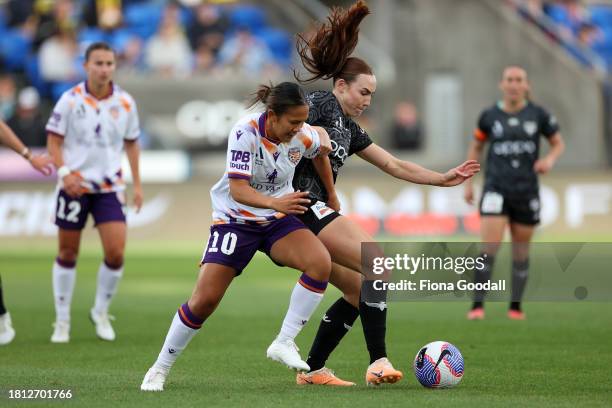 Rasamee Phonsongkham of Perth competes with Mackenzie Barry of Wellington during the A-League Women round six match between Wellington Phoenix and...