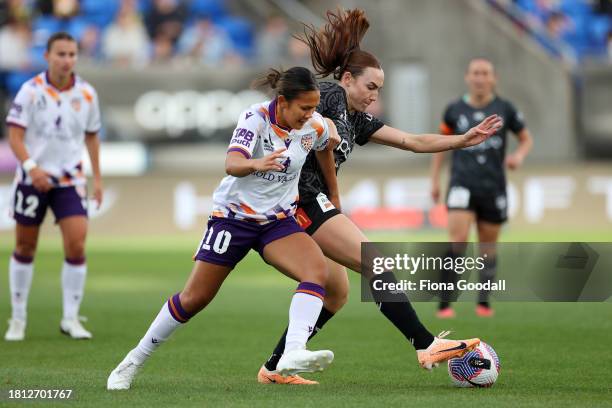 Rasamee Phonsongkham of Perth competes with Mackenzie Barry of Wellington during the A-League Women round six match between Wellington Phoenix and...